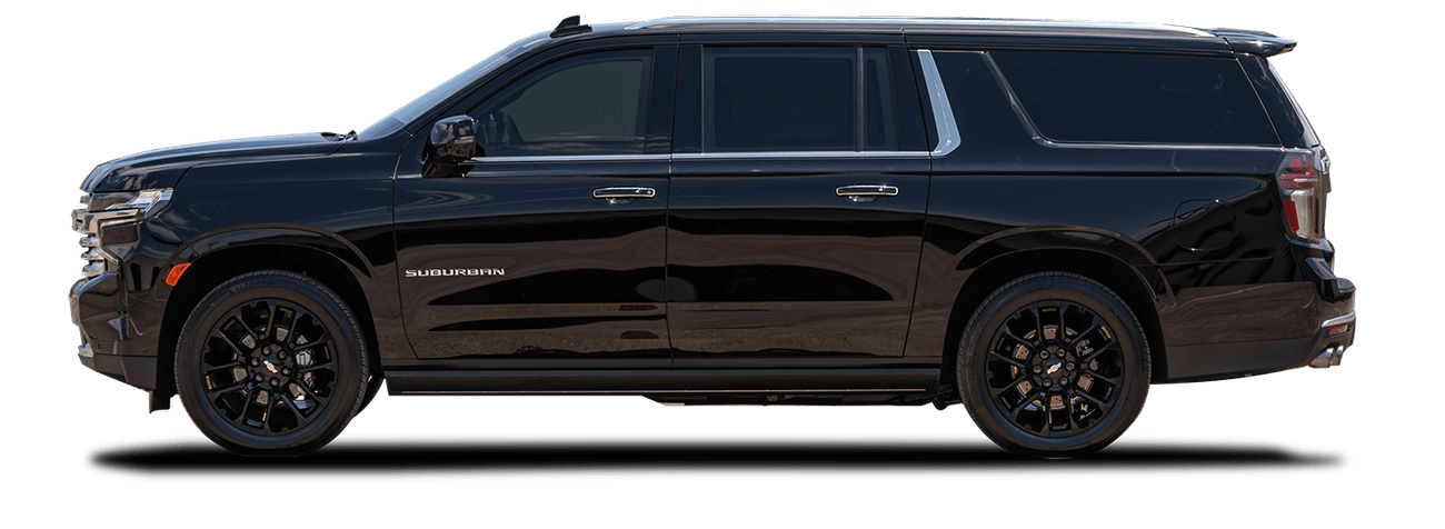 Image of a black Chevrolet Suburban taken from the driver side.