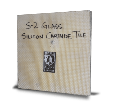 A square tile labeled "S-2 Glass, Silicon Carbide Tile" with net-like texture and a small emblem in the center.