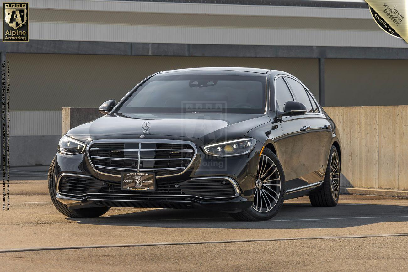 A black Mercedes-Benz S580 sedan is parked on a rooftop, captured in daylight, with "Alpine Detailing" branding visible in the image.