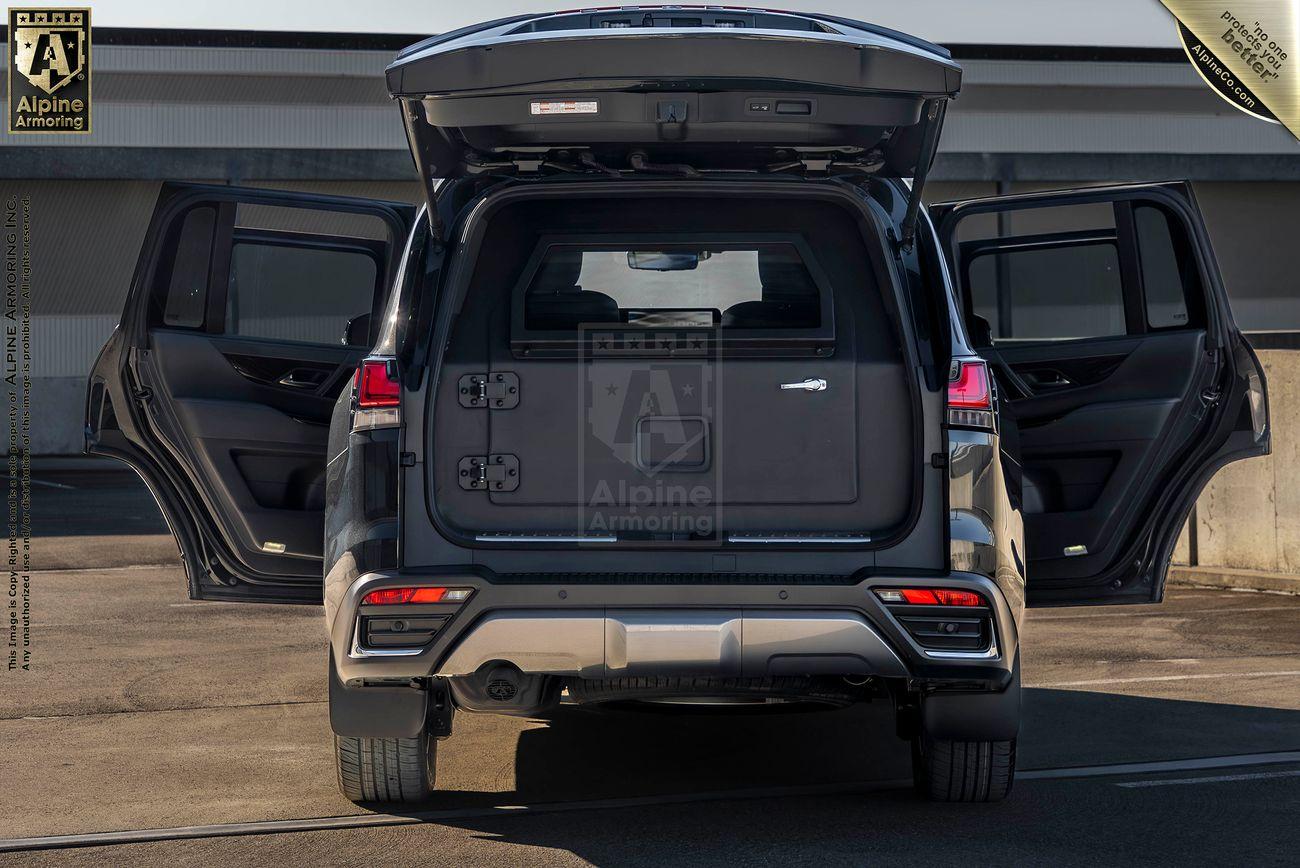 Rear view of an armored Lexus LX600 Ultra Luxurywith its doors opened.