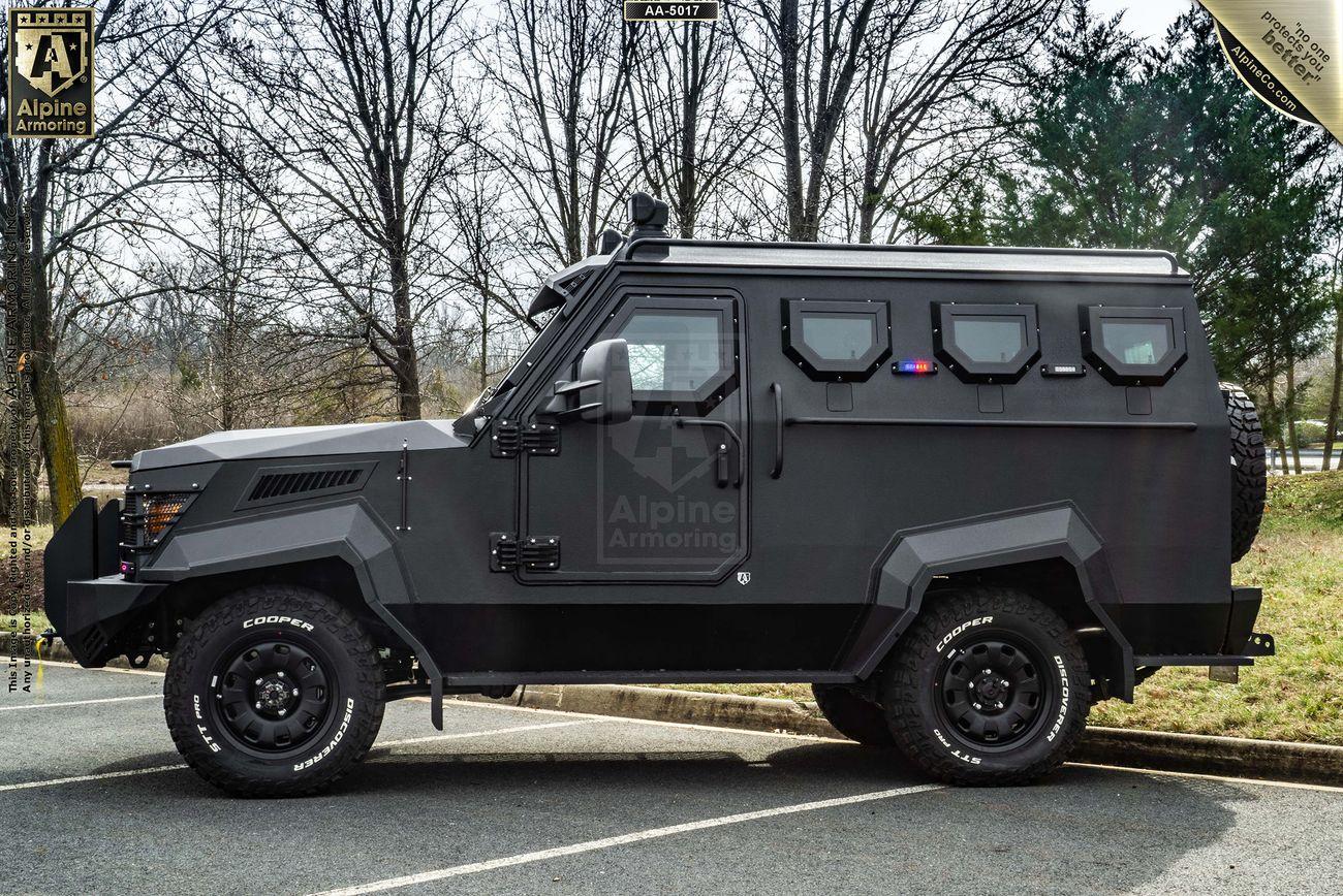 A black armored SWAT APC CUDA parked in a parking lot.