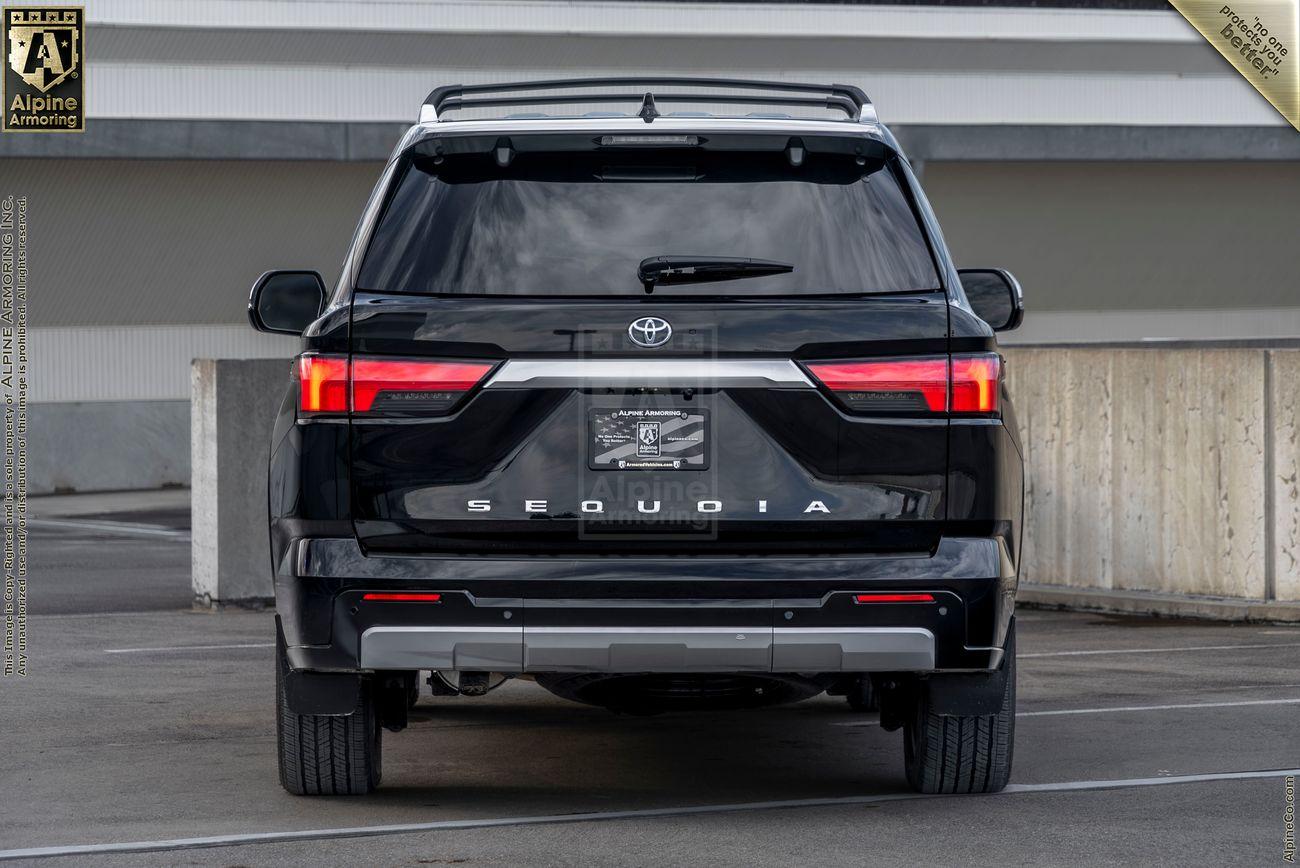 Rear view of a black Toyota Sequoia Capstone SUV from Alpine Armoring with bold lettering and sleek taillights.