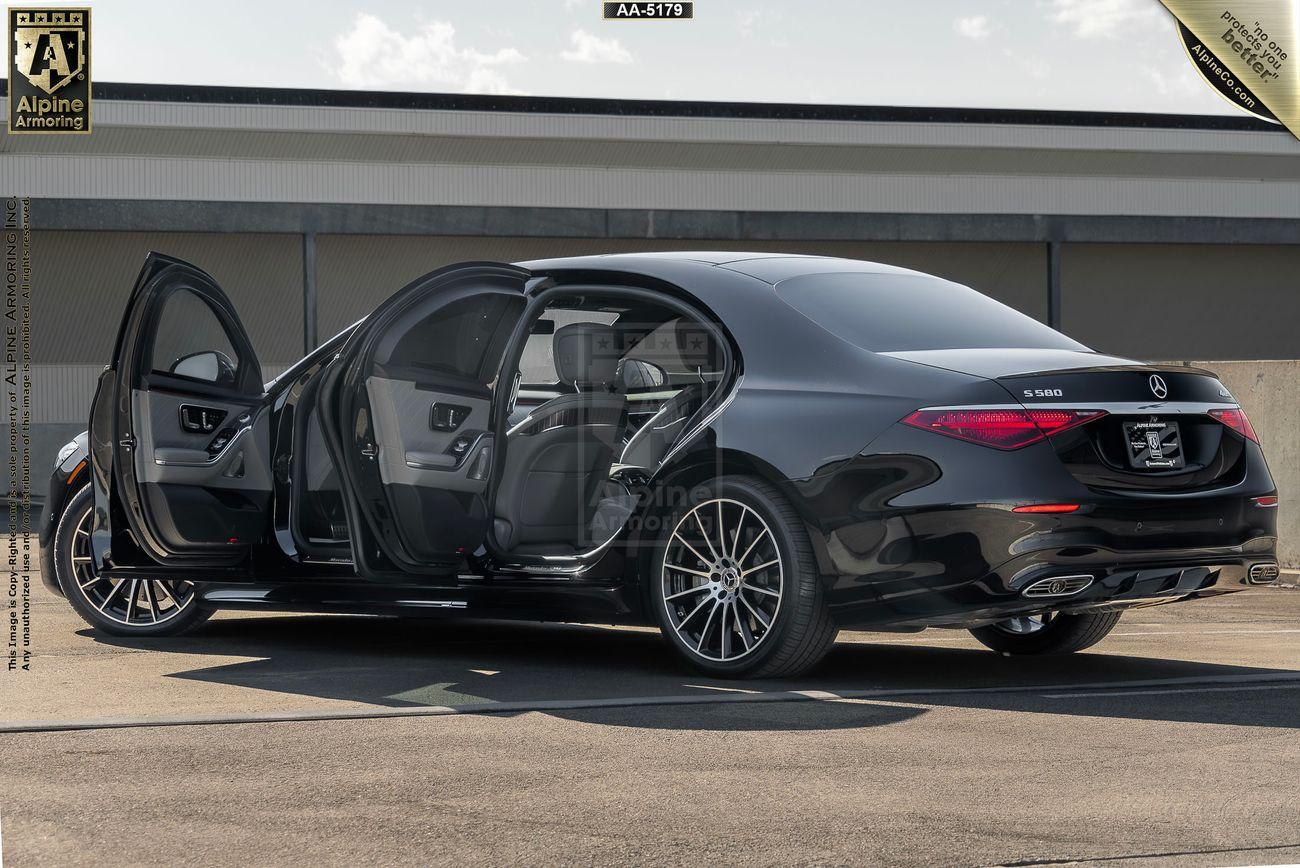 A black Mercedes-Benz S580 4MATIC from Alpine Armoring, showcasing its luxurious and armored features. The vehicle is parked outdoors, highlighting its sleek design and advanced security capabilities.