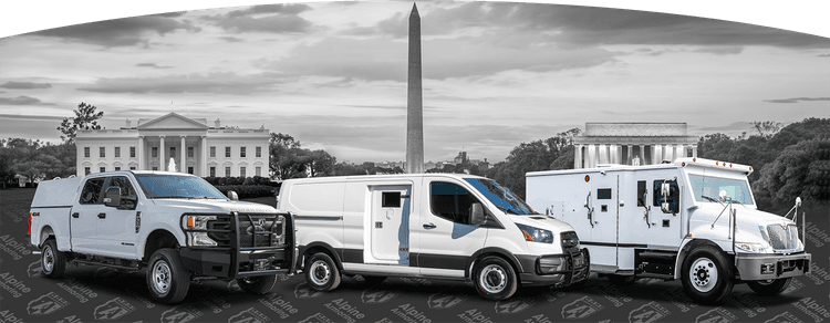 A lineup of various armored vehicles in front of iconic Washington, D.C. landmarks including the White House, the Washington Monument, and the Lincoln Memorial. 