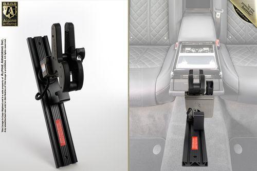 Two images show a gun holster attached to a car's center console. Left image is a standalone view of the holster, while the right image shows the holster installed in a luxury car's rear seating area.