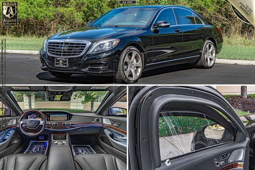 A luxury black Mercedes-Benz S550 parked on asphalt. Image includes exterior front view, interior dashboard and seating area, and a close-up of the rear passenger door. Trees are in the background.