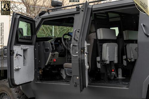 Interior view of a Pit-Bull VXT displaying open driver's and passenger's side doors, seats, and dashboard controls.